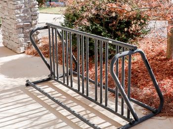A set of stairs with metal railings on a sidewalk